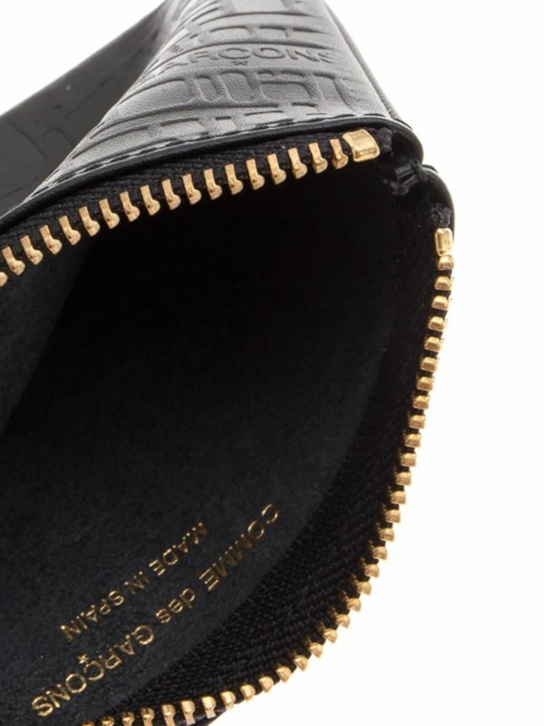 Embossed Logo pouch in black shop online: COMME DES GARÇONS WALLET