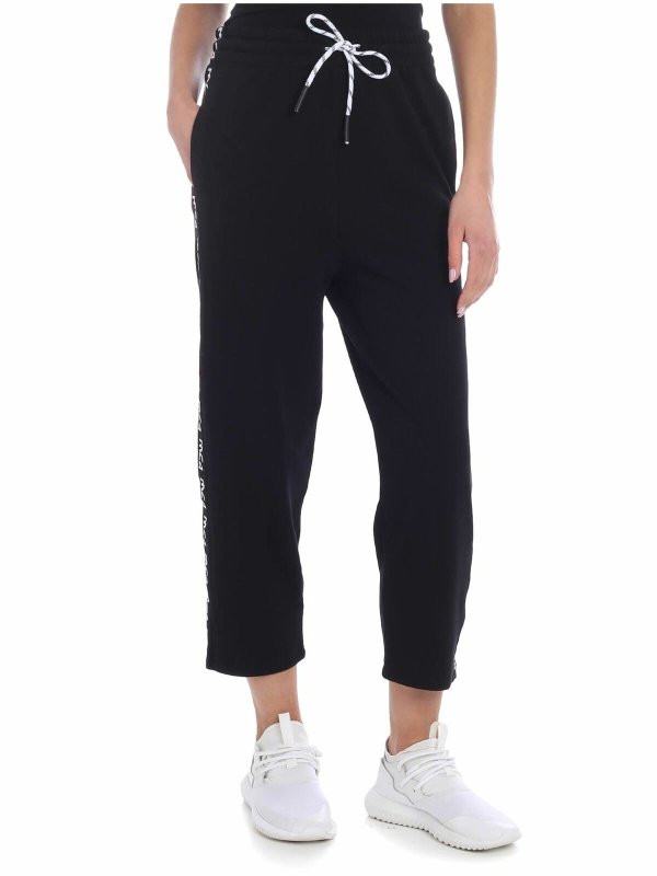 McQ Alexander Mcqueen: tracksuit bottoms - McQ black pants with branded stripes