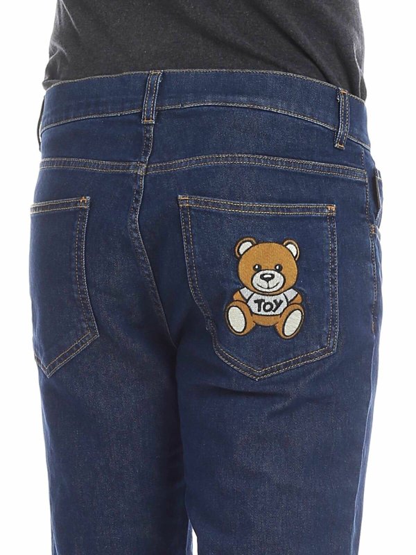 Jeans blu con Moschino Teddy Bear shop online: MOSCHINO