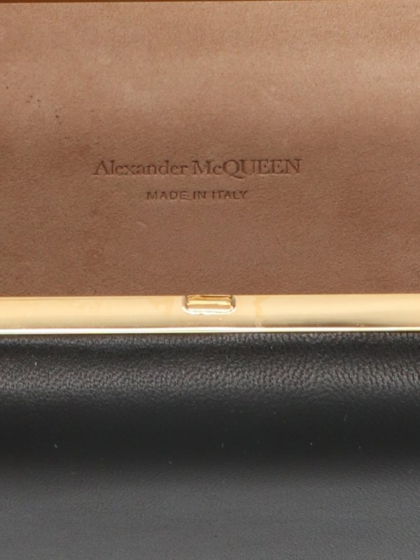 Skull and ring clutch shop online: ALEXANDER MCQUEEN