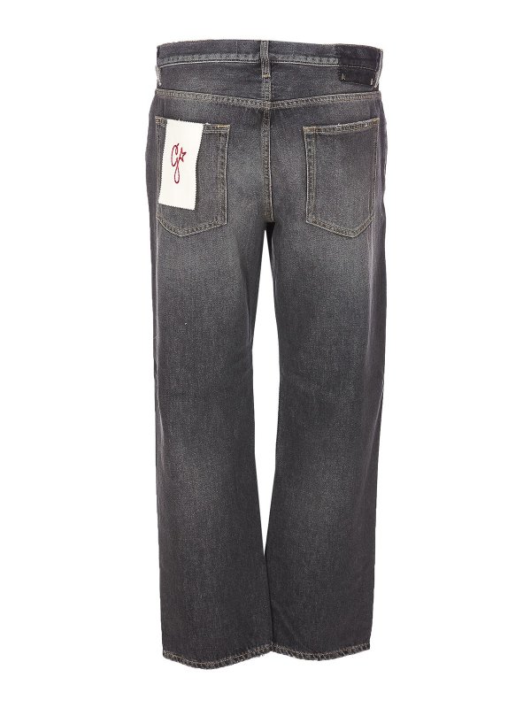 GOLDEN GOOSE: flared jeans online - Wide leg Jeans with faded effect and logo