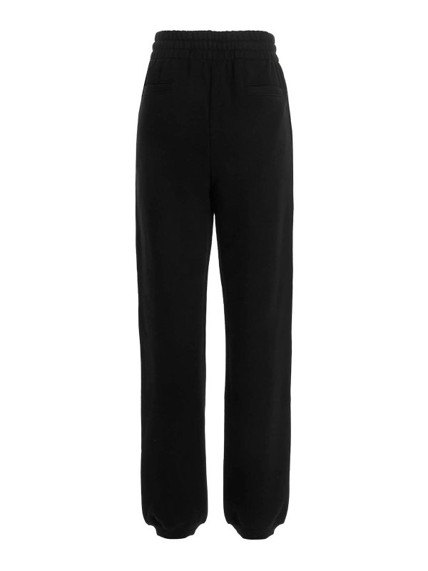 MOSCHINO: スウェットパンツ online - トラックスーツ ボトムス - 黒