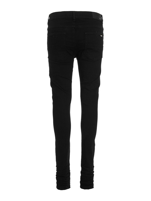 AMIRI: jeans skinny online - impilare i jeans