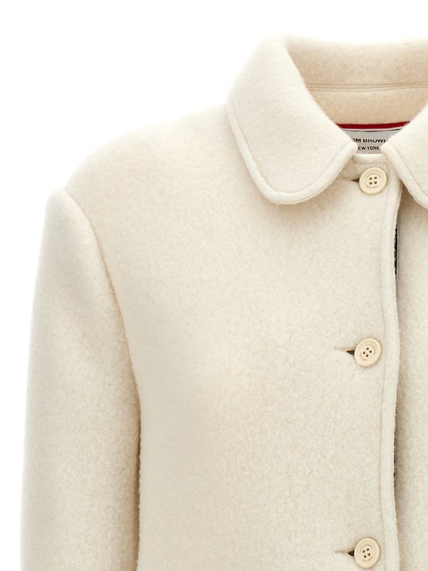 The Best Shops THOM BROWNE: knee length coats - Logo patch wool coat