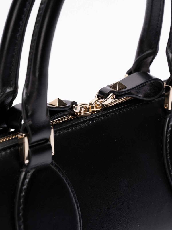 `rockstud e/w` leather duffle bag shop online: VALENTINO GARAVANI