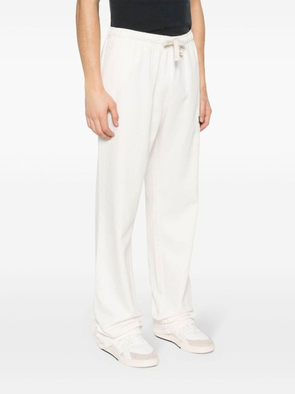 Monogram travel pants shop online: Palm Angels