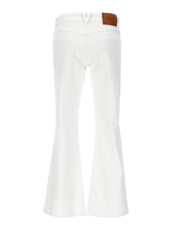 VERSACE: ベルボトムジーンズ online - フレアジーンズ - 白