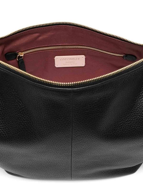 Pochette shop online: COCCINELLE