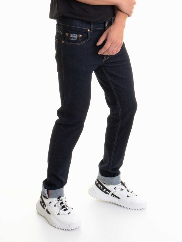 Versace Jeans Couture: ブーツカットジーンズ online - ブーツカットジーンズ - ミディアムウォッシュ