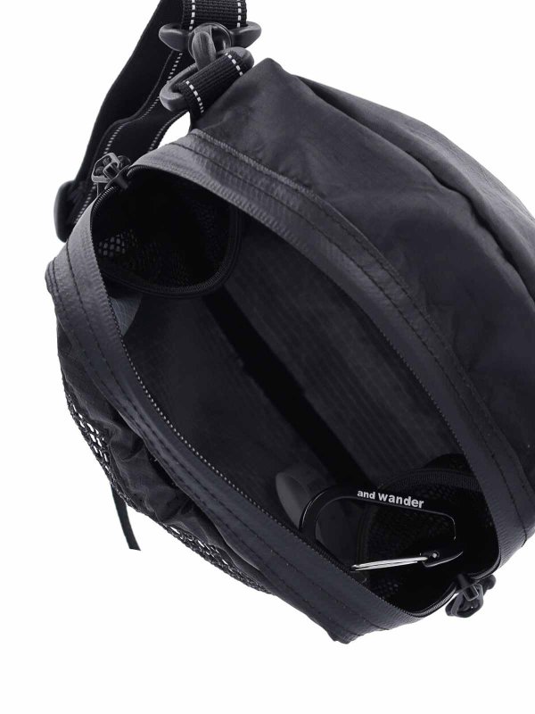 Clutch - Schwarz shop online: AND WANDER