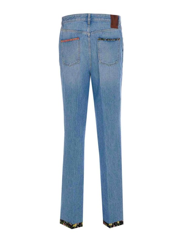 Pantaloni di denim con stampa floreale shop online: VALENTINO GARAVANI