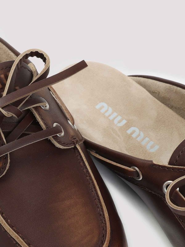 Mules shop online: MIU MIU