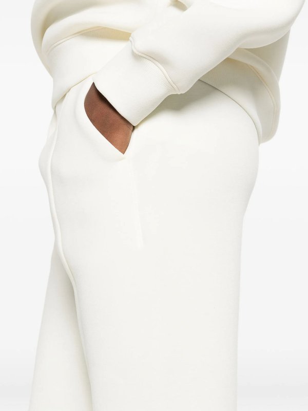 カジュアルパンツ - クリーム shop online: CALVIN KLEIN