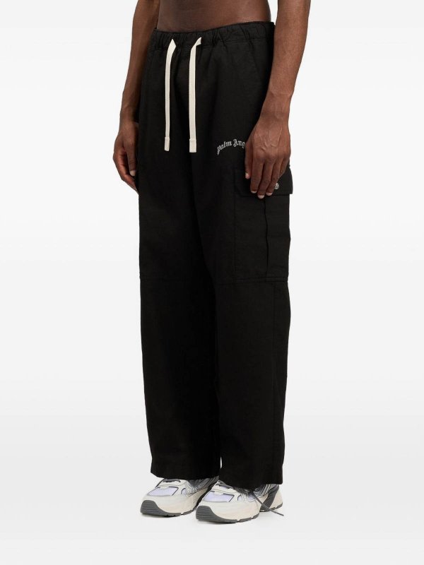 カジュアルパンツ - 黒 shop online: Palm Angels
