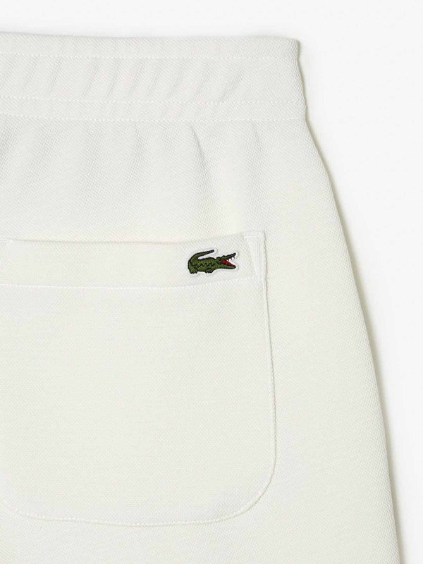 The Best Shops LACOSTE: スウェットパンツ - トラックスーツ ボトムス - クリーム