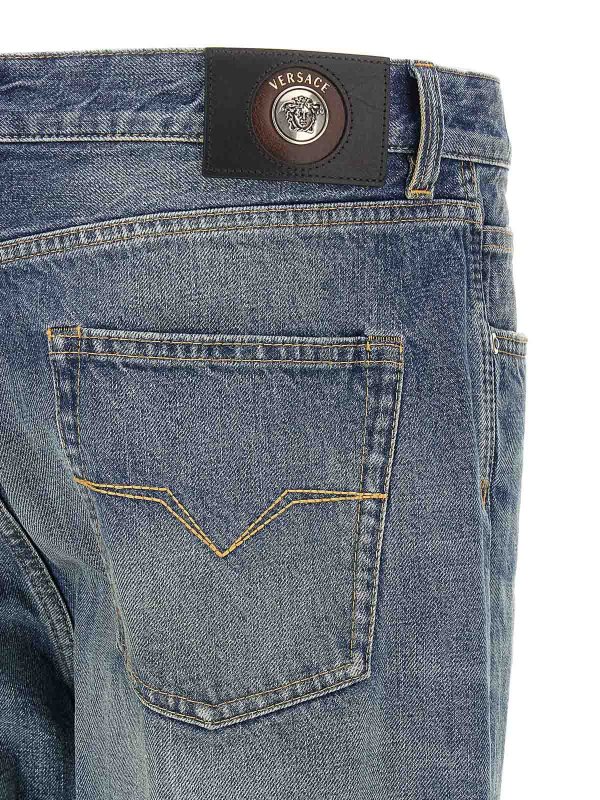 Distressed jeans shop online: VERSACE