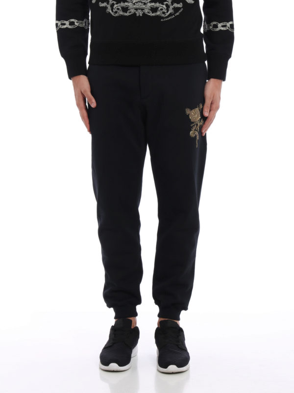 ALEXANDER MCQUEEN: tracksuit bottoms online - Embroidered rose tracksuit bottoms