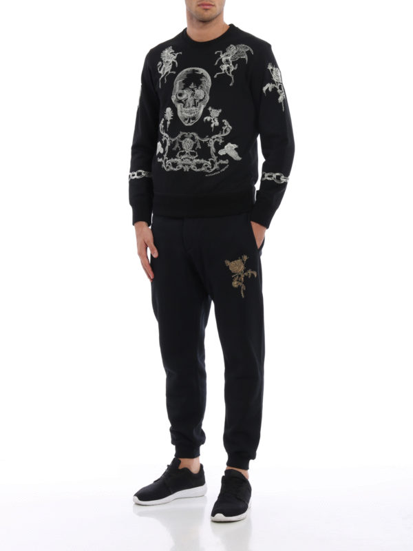 Embroidered rose tracksuit bottoms shop online: ALEXANDER MCQUEEN