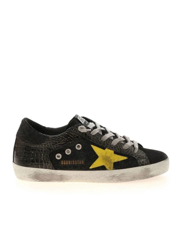 GOLDEN GOOSE: trainers - Superstar sneakers in black and gold