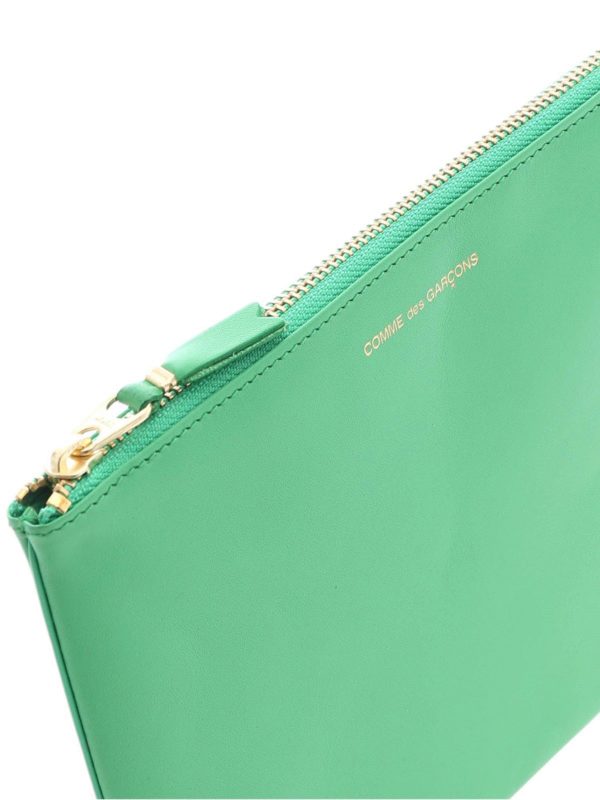 Logo print leather clutch shop online: COMME DES GARÇONS WALLET