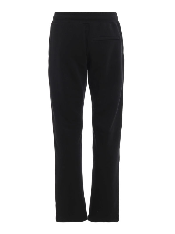 MOSCHINO: tracksuit bottoms online - Golden logo print cotton joggers