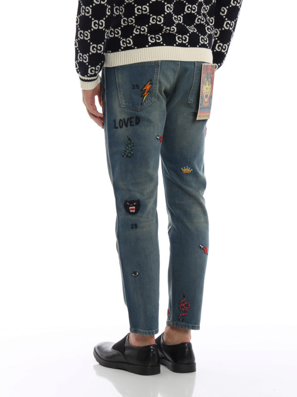 Multi patch washed denim jeans shop online: GUCCI