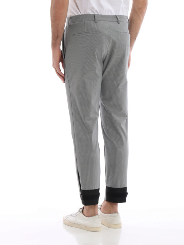 Patterned stretch tech fabric trousers shop online: PRADA