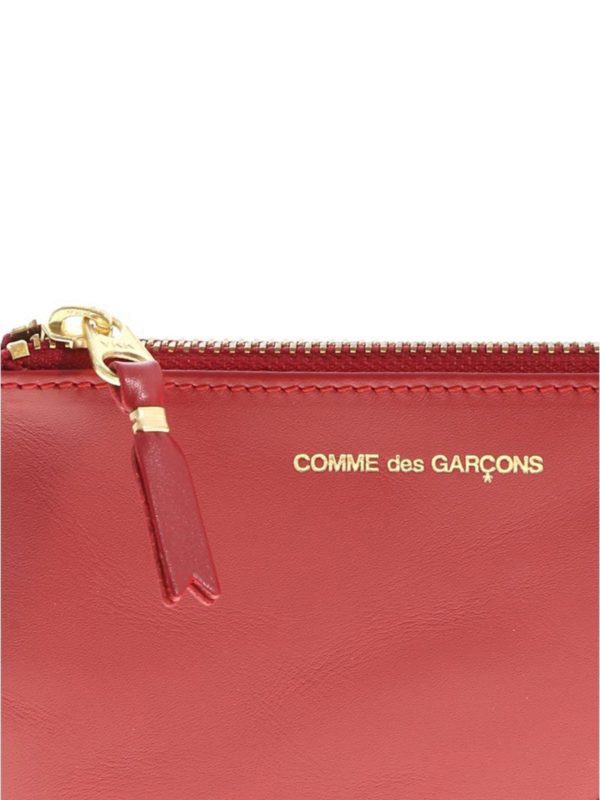 Clutch - Rot Replica 
online: COMME DES GARÇONS WALLET