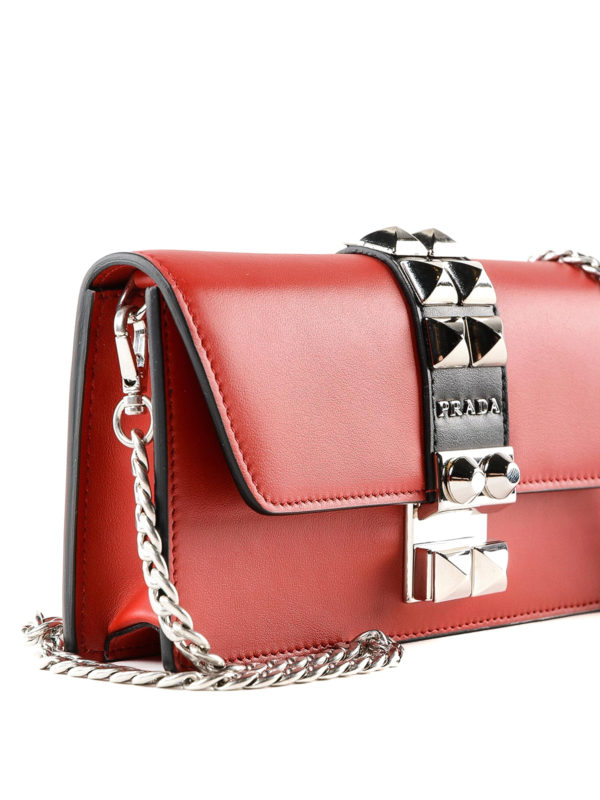 Studded leather clutch with chain strap shop online: PRADA