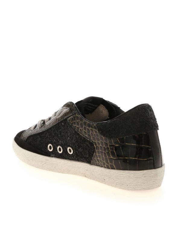 Superstar sneakers in black and gold shop online: GOLDEN GOOSE