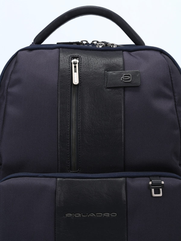Water resistant blue backpack shop online: PIQUADRO