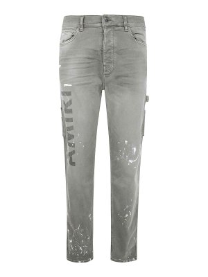 AMIRI: jeans dritti, a sigaretta - Jeans slim con stencil