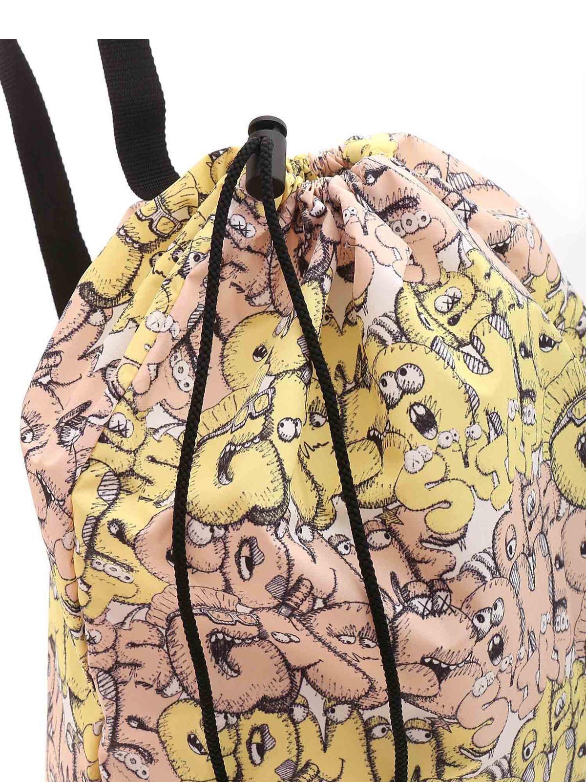 Shop Comme Des Garçons Shirt Kaws Backpack In Yellow