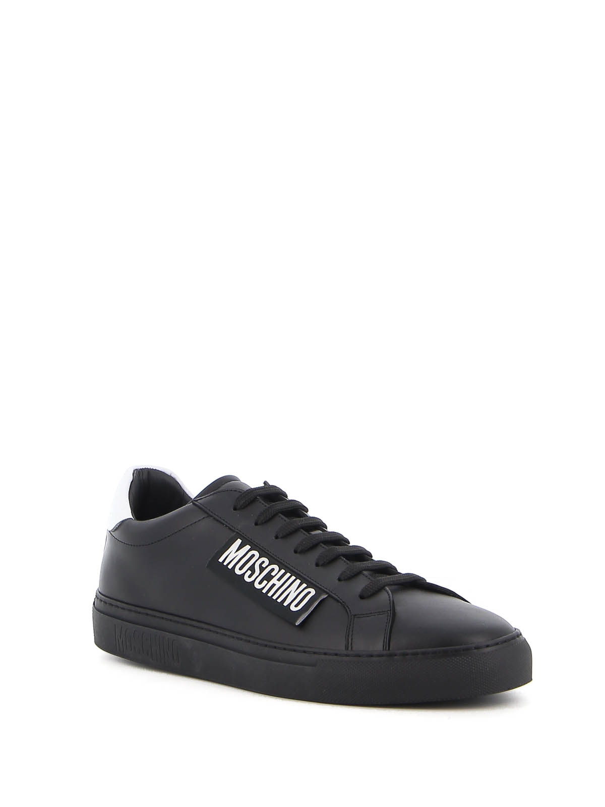 Shop Moschino Label Leather Sneakers In Black