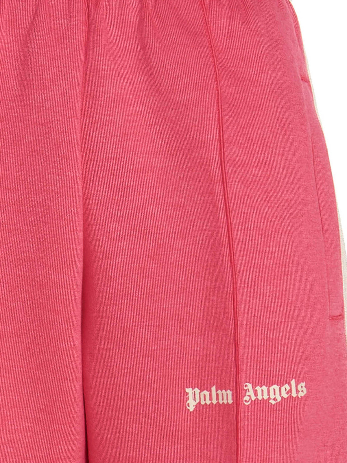 PALM ANGELS: jogging trousers with all over logo - Red