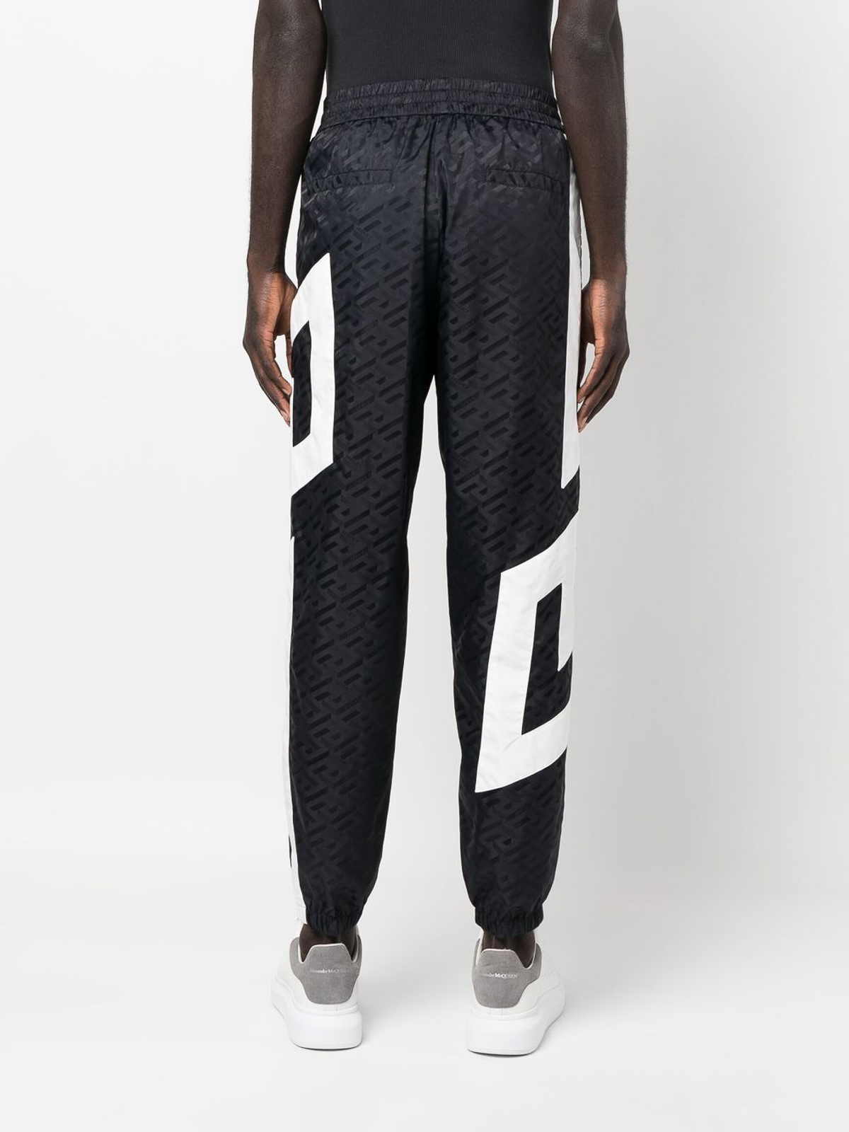 Buy Pants Balenciaga logo-print track pants (755118 TOVV2) | Luxury online  store First Boutique