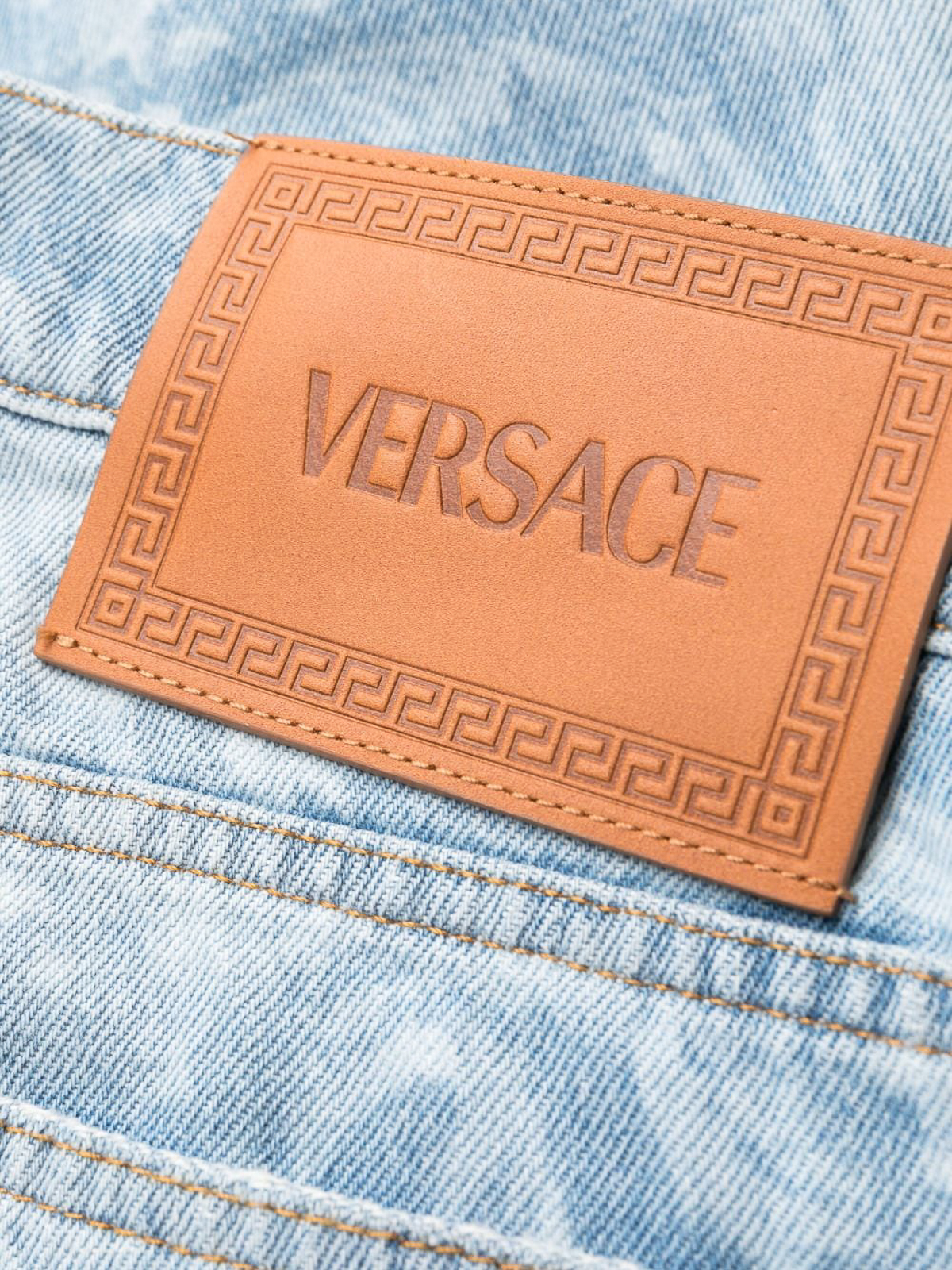 Shop Versace Logo All Over Denim Jeans In Blue