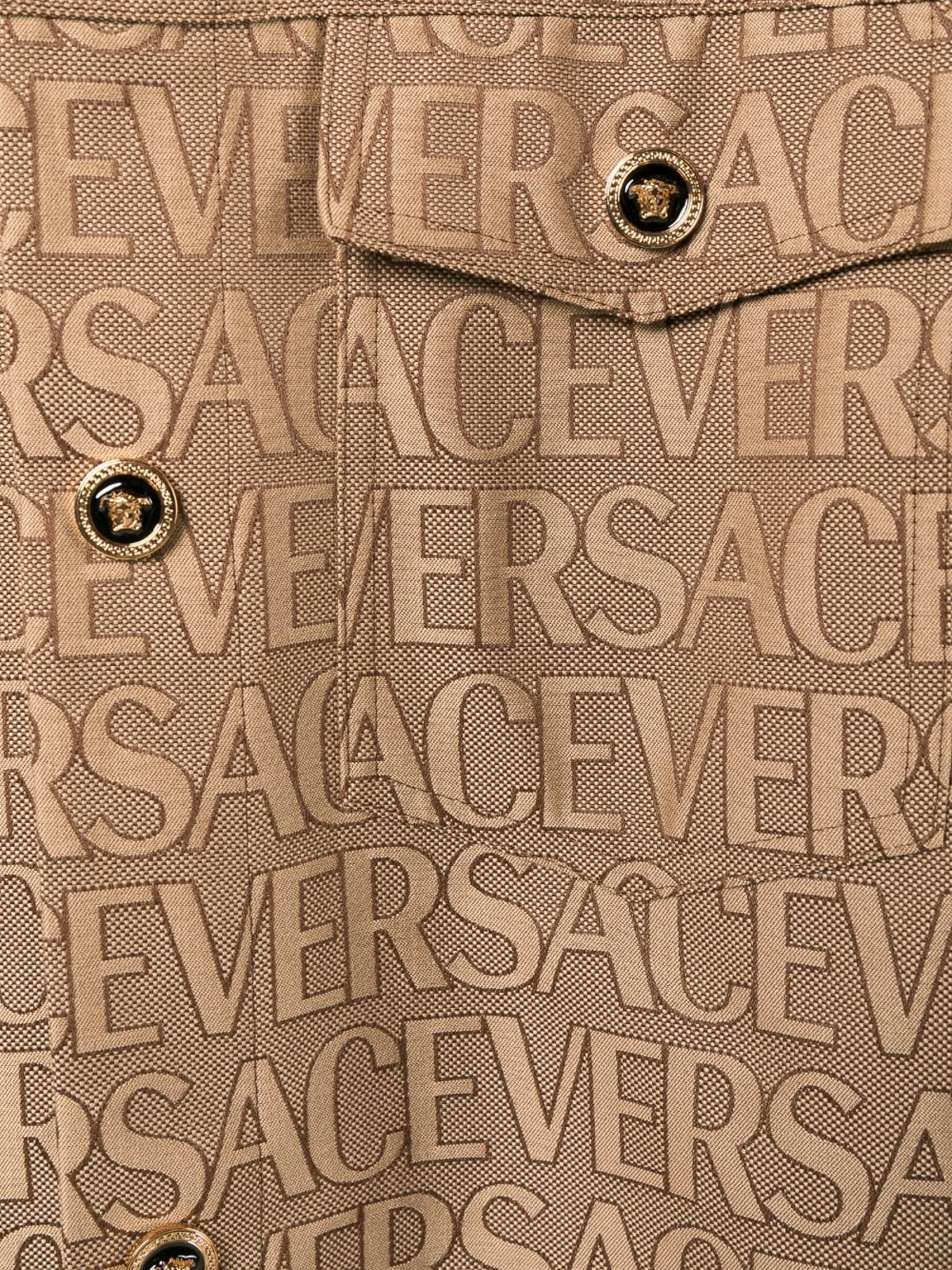 Shop Versace Logo All Over Canvas Blouson In Brown
