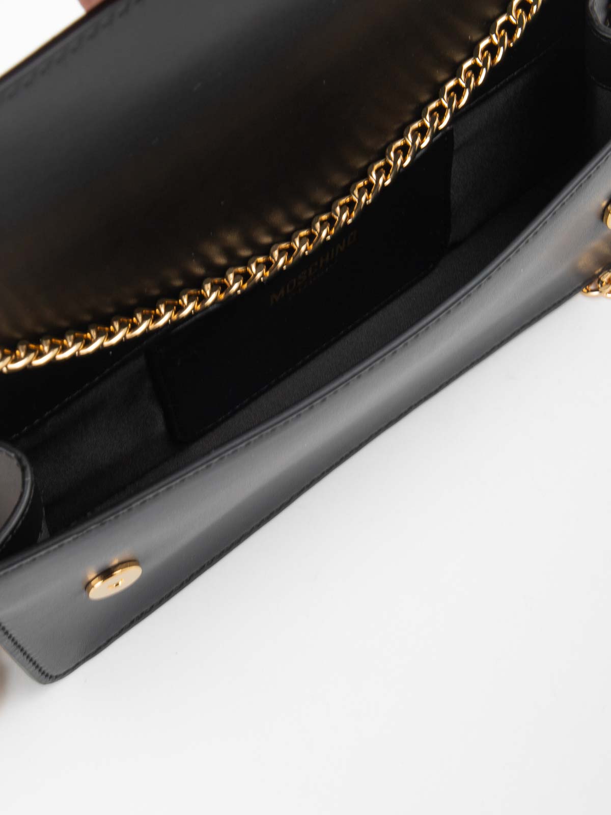 Shop Moschino Leather Clutch In Black
