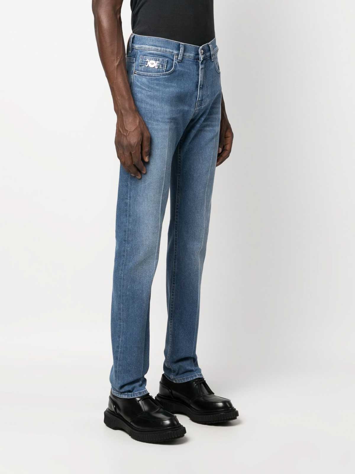 Shop Versace Straight Leg Denim Jeans In Light Wash