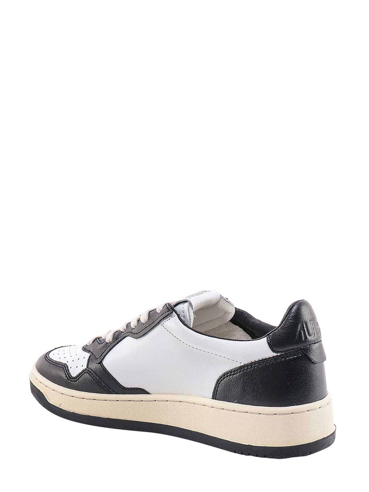 Shop Autry Leather Sneakers In Black