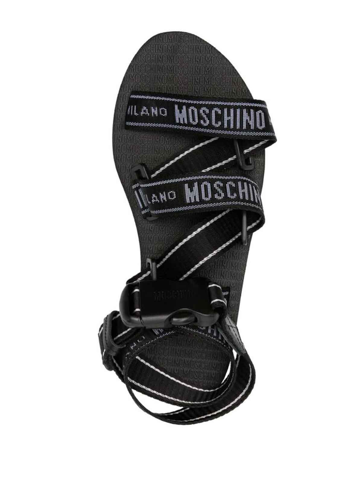 Shop Moschino Logo-print Embossed Logo Sandals In Black