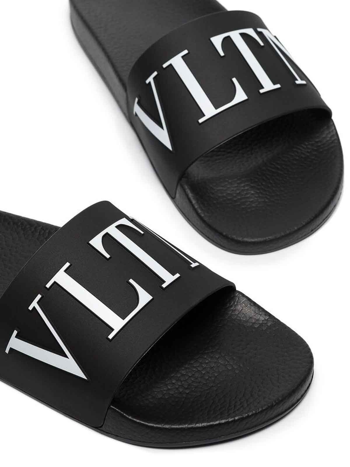 Shop Valentino Logo Slippers In Black