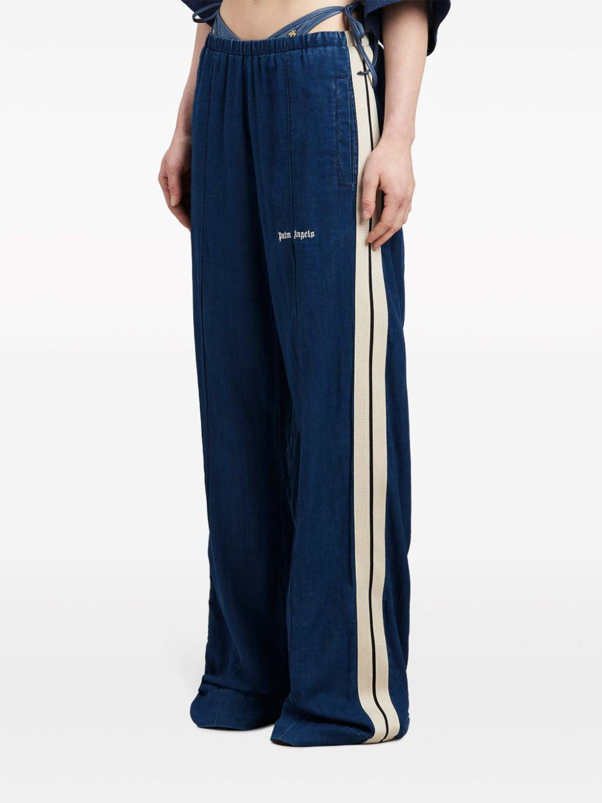 Shop Palm Angels Side-stripe Chambray Trousers In Blue