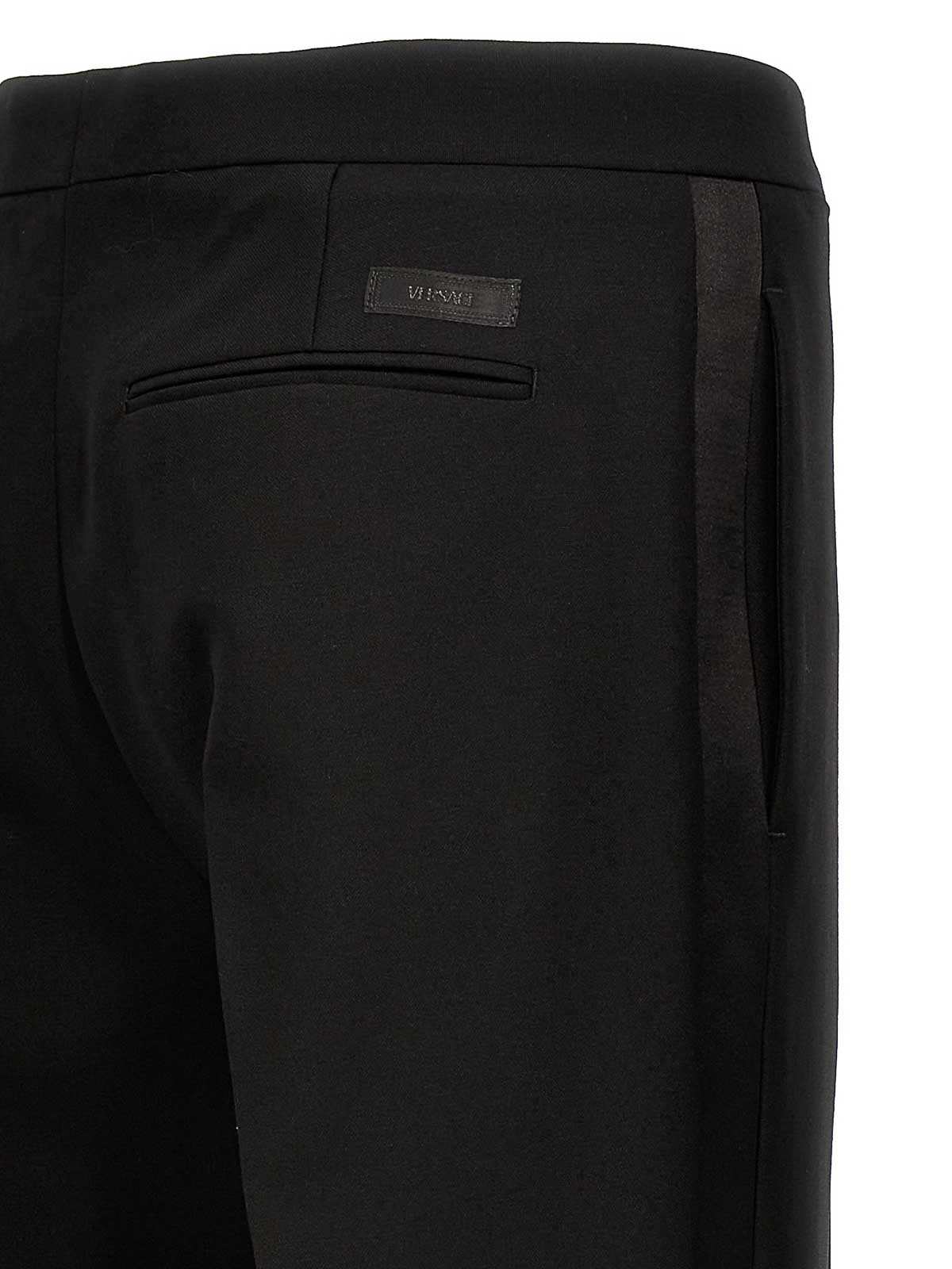 Shop Versace Pantalones De Sastrería - Negro In Black