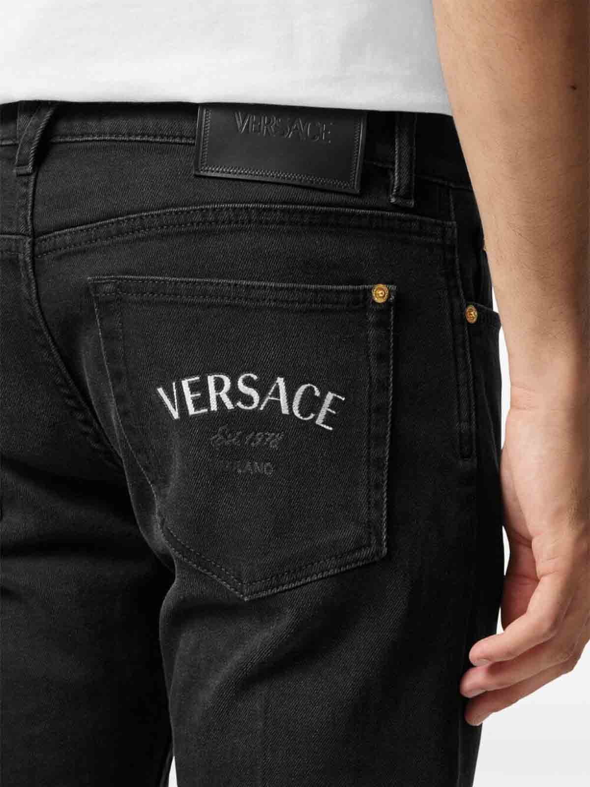 Shop Versace Embroidery Jeans In Negro