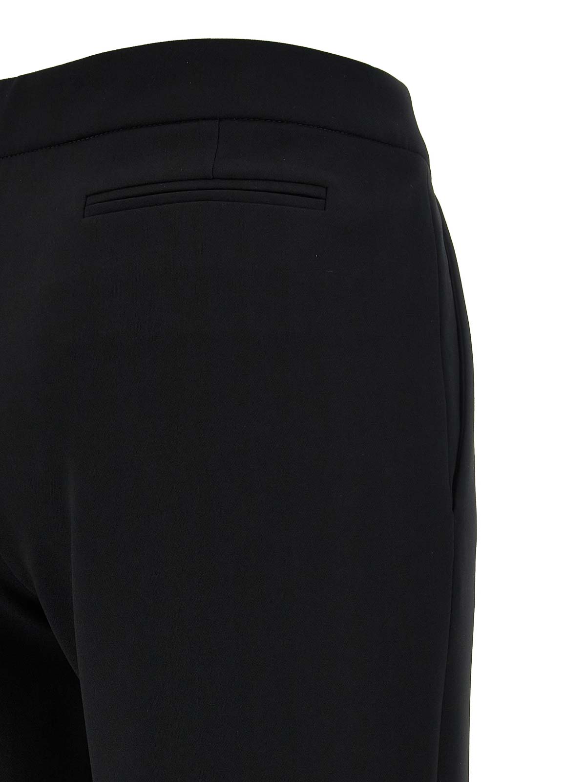 Shop Moschino Crepe Flared Pants In Black