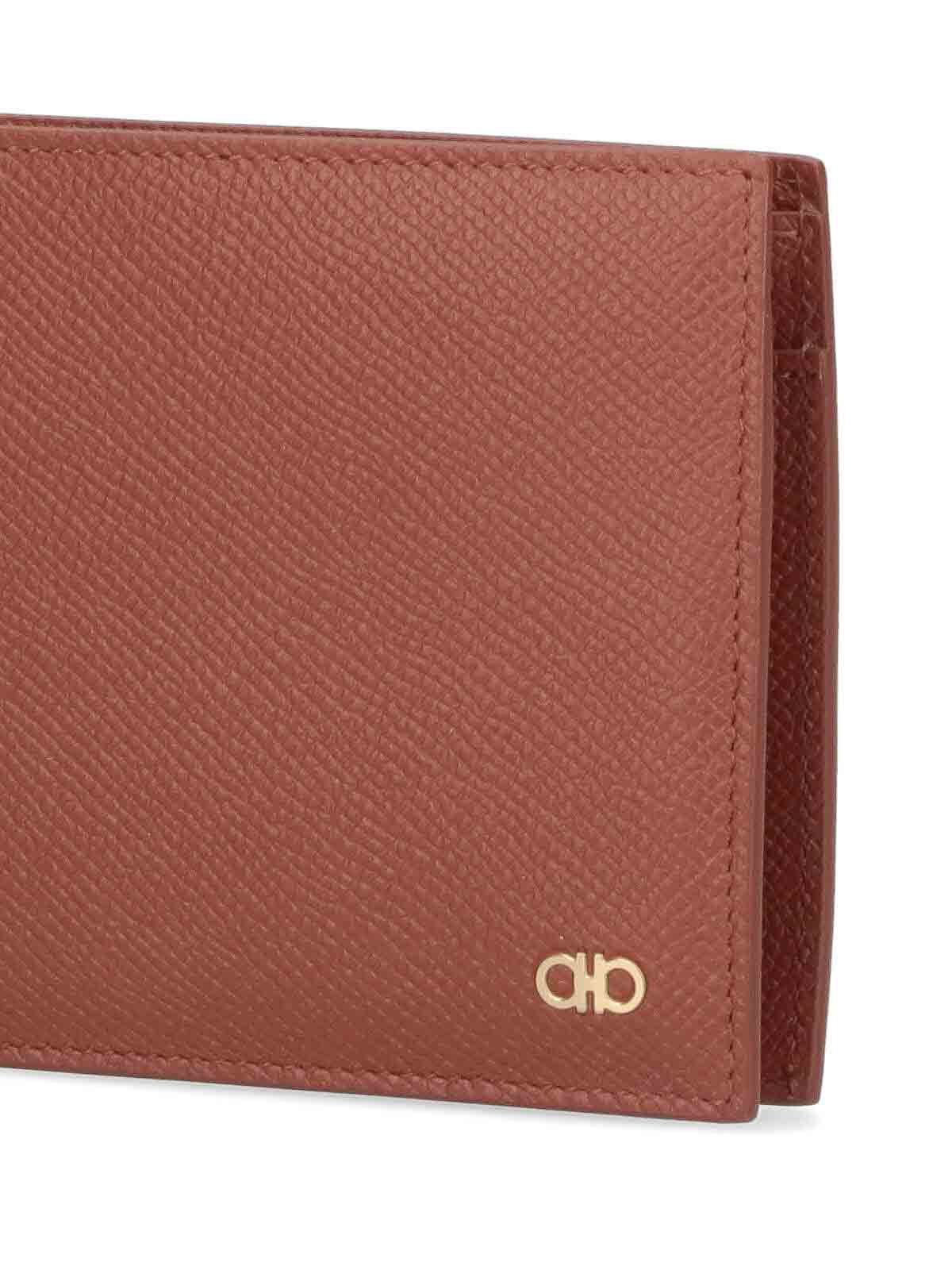 Shop Ferragamo Bi-fold Wallet In Brown