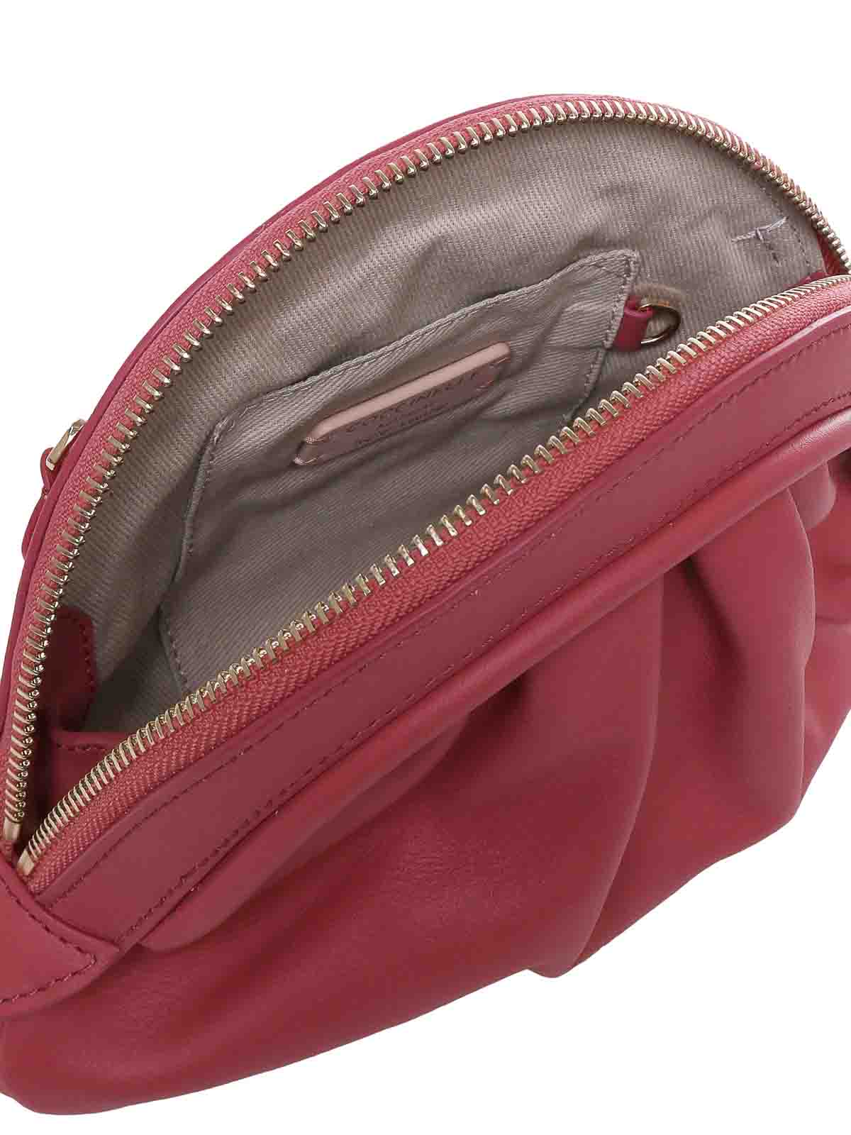 Shop Coccinelle Cheek Clutch In Rosado