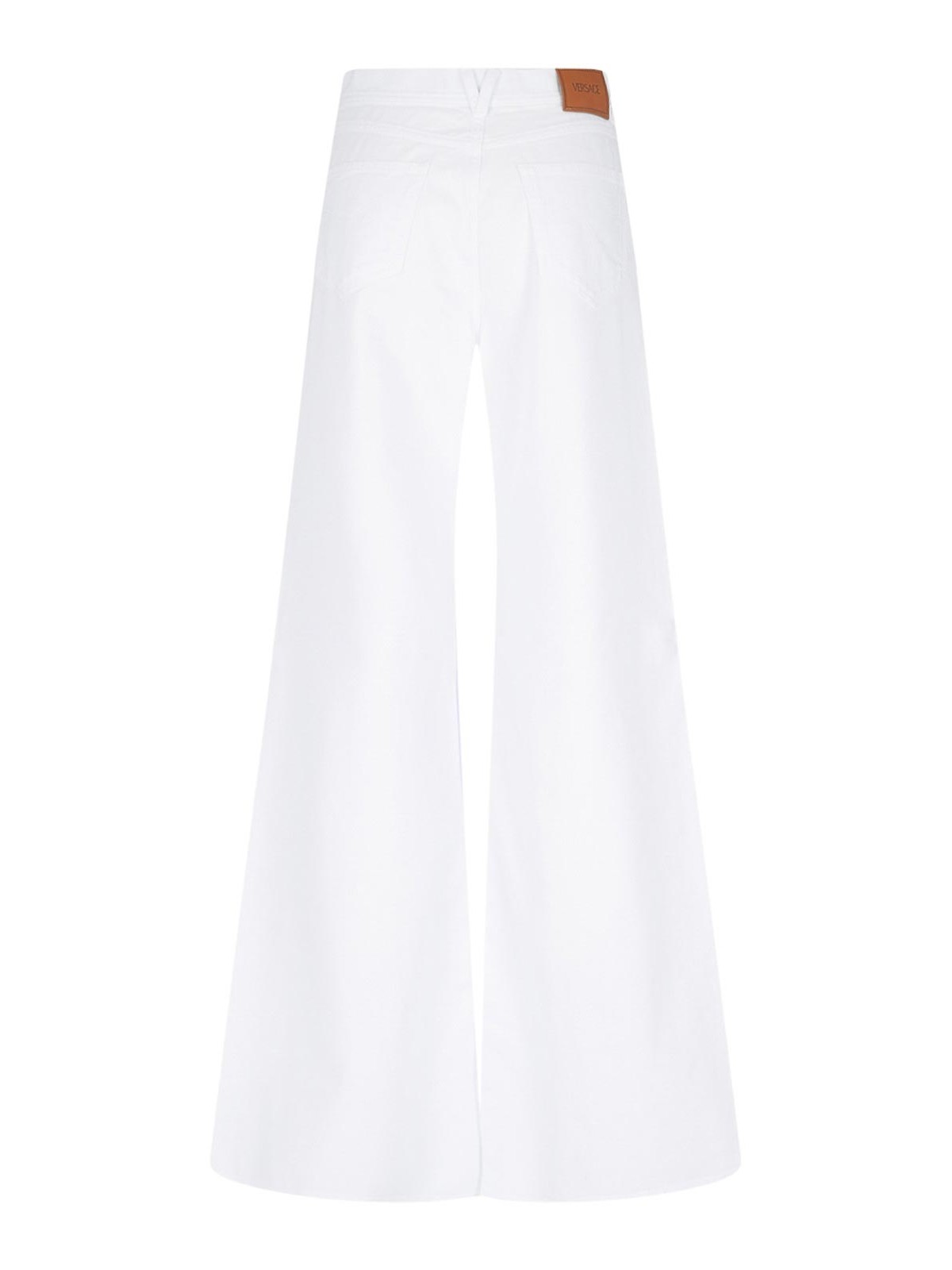 Shop Versace Palazzo Logo Jeans In White